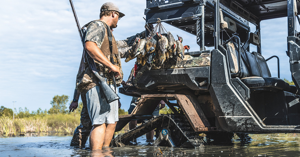 Waterfowl hunter preparing gear on UTV. Photo by Ed Wall Media